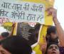 Protesters fight to hold on to their placards.jpg
